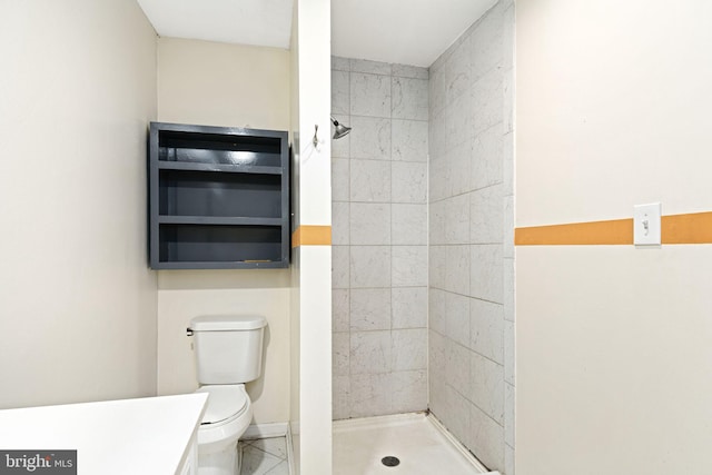 bathroom featuring a stall shower and toilet