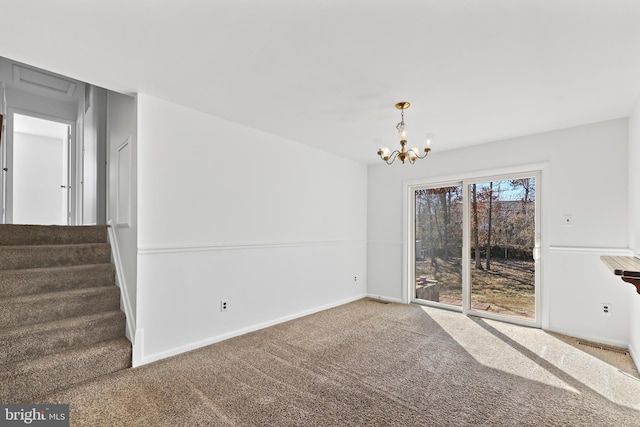 unfurnished dining area featuring carpet floors, a notable chandelier, baseboards, and stairs