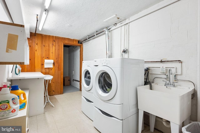 9621 E Bexhill Dr, Kensington, MD 20895 - laundry area featuring concrete block wall, laundry area, a sink, and washer and dryer