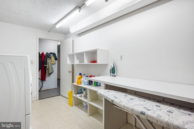 9621 E Bexhill Dr, Kensington, MD 20895 - washroom featuring washer / clothes dryer, laundry area, and a textured ceiling
