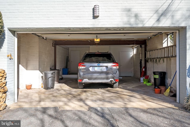 9621 E Bexhill Dr, Kensington, MD 20895 - garage featuring a garage door opener