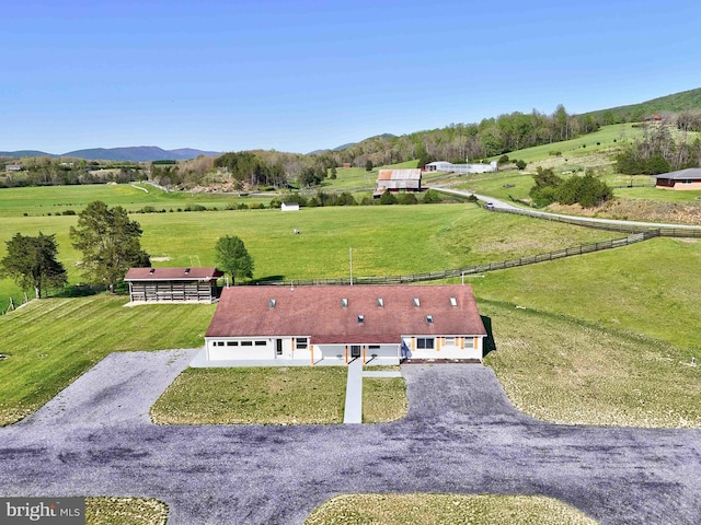 drone / aerial view featuring a rural view and a mountain view