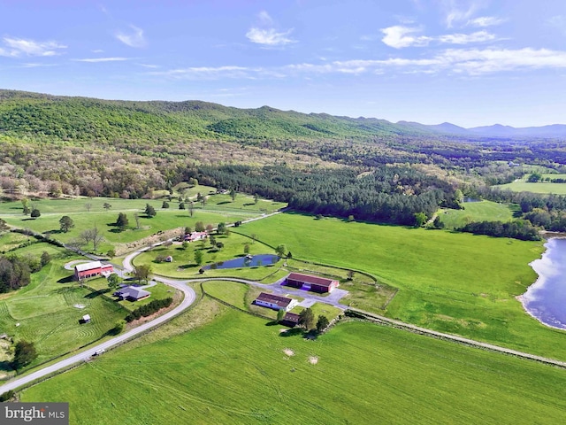 bird's eye view with a wooded view and a water and mountain view