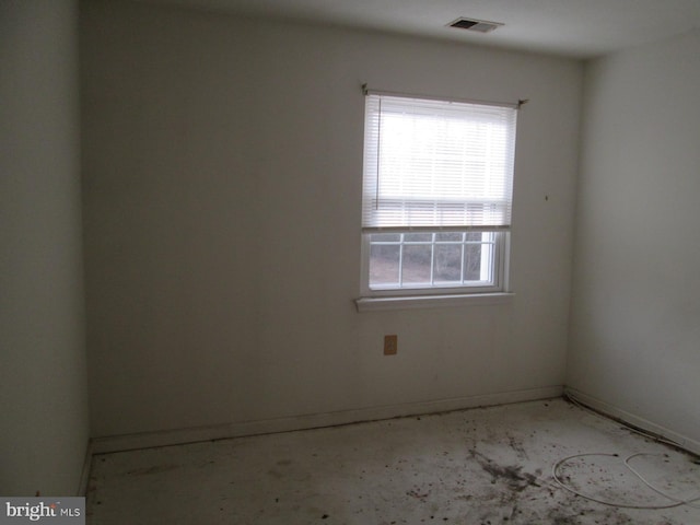empty room featuring baseboards