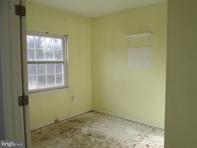 empty room featuring baseboards