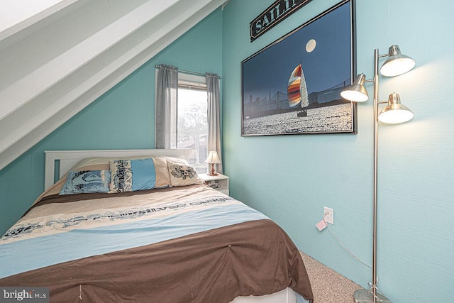 bedroom with lofted ceiling