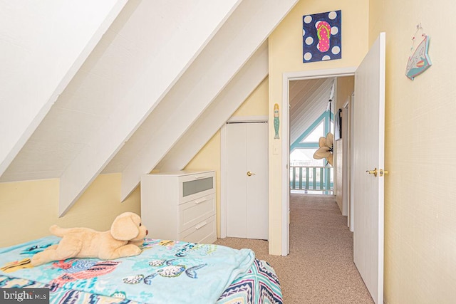 carpeted bedroom featuring vaulted ceiling