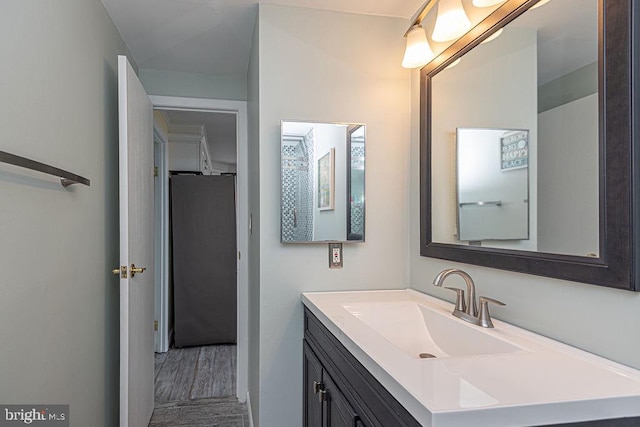 bathroom featuring vanity and wood finished floors