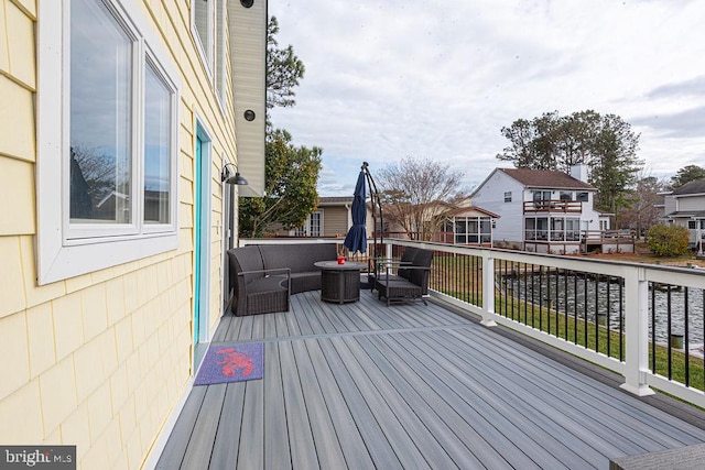 wooden deck with an outdoor living space