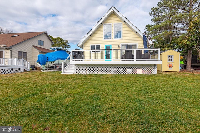 back of house with a lawn and a wooden deck