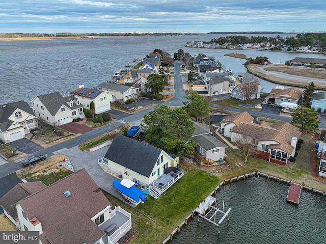 bird's eye view with a water view and a residential view