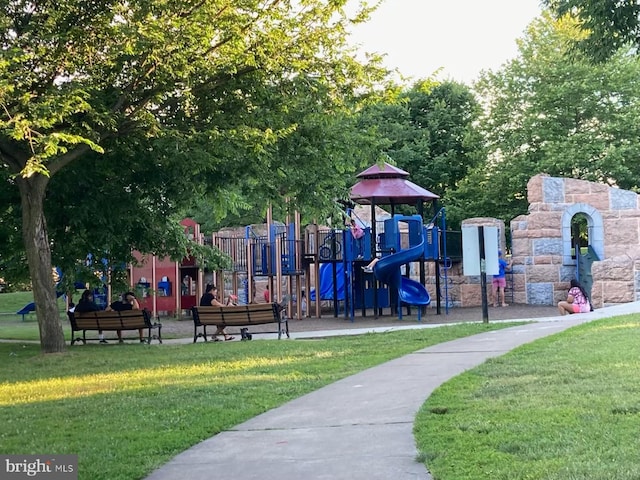 communal playground featuring a yard