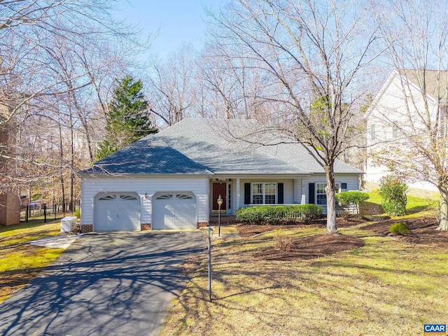 ranch-style house with a garage, driveway, a front yard, and cooling unit