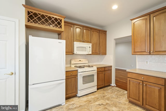 kitchen featuring brown cabinets, recessed lighting, light countertops, backsplash, and white appliances