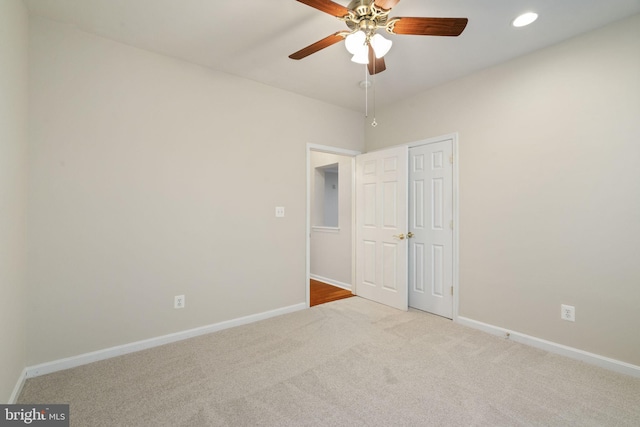 unfurnished bedroom featuring recessed lighting, a closet, carpet flooring, and baseboards