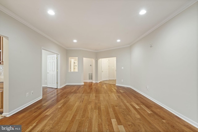 unfurnished living room featuring visible vents, baseboards, crown molding, light wood-style floors, and recessed lighting