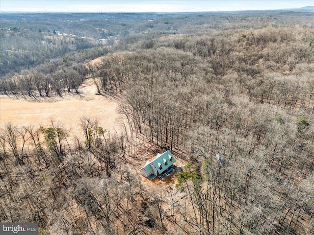 drone / aerial view with a view of trees