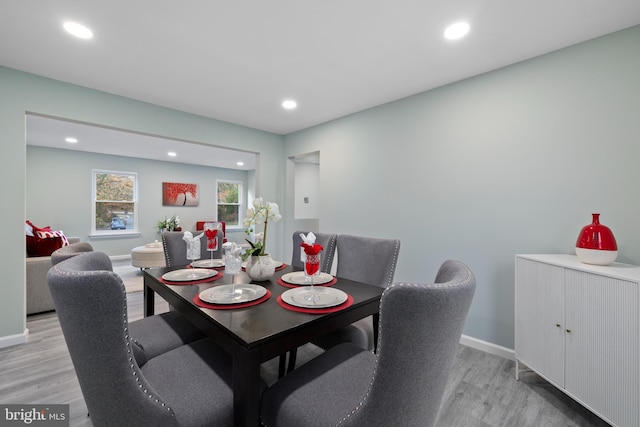 dining room featuring light wood finished floors and recessed lighting