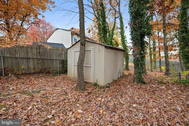 view of shed featuring a fenced backyard