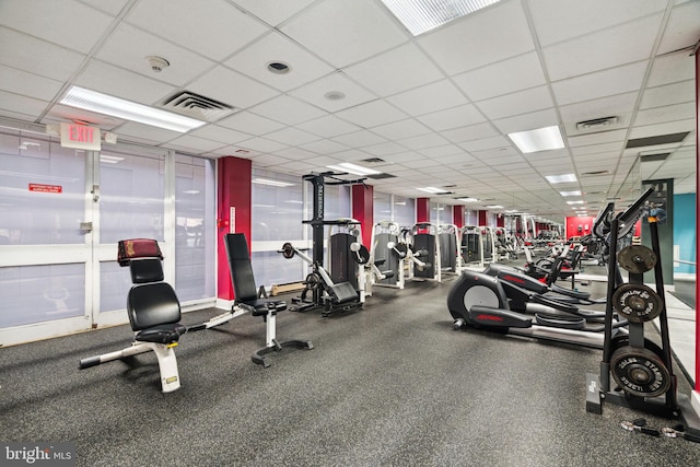 exercise room featuring visible vents and a drop ceiling