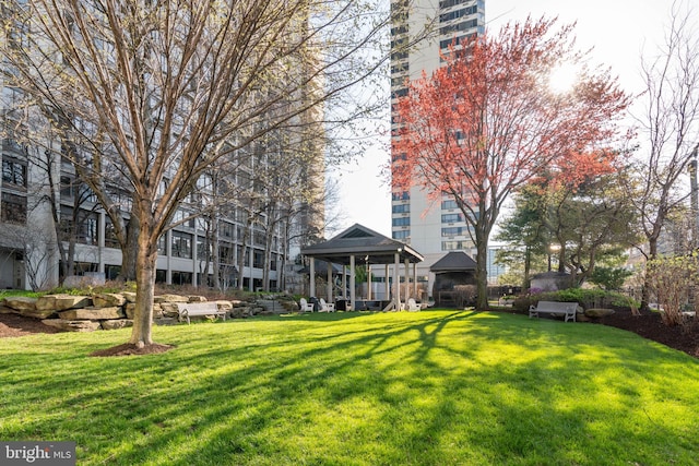 view of community with a gazebo and a yard