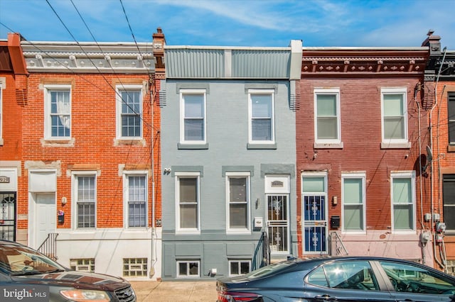 view of property with brick siding