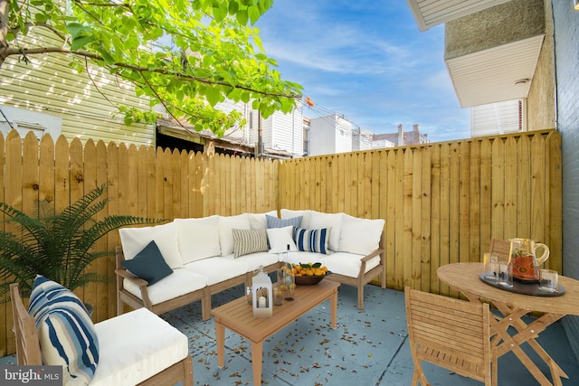 view of patio / terrace with fence and an outdoor hangout area