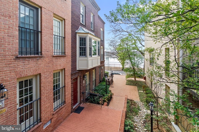 view of side of property with brick siding