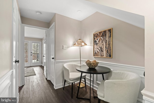 dining area with dark wood-style flooring and french doors