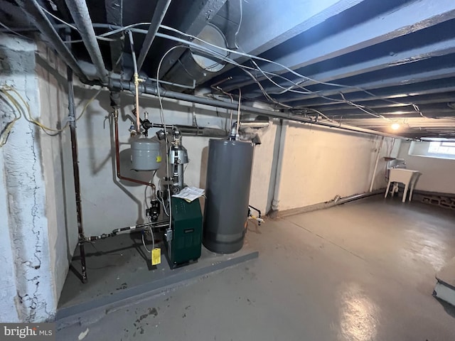 below grade area featuring gas water heater and a sink