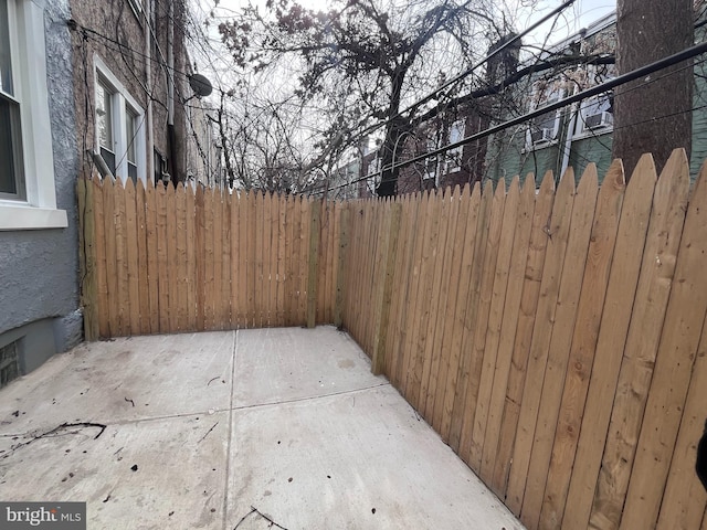 view of patio / terrace featuring fence