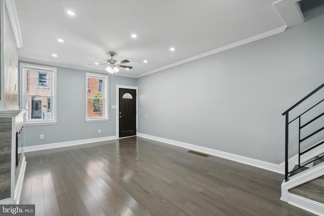 entryway featuring visible vents, baseboards, dark wood finished floors, stairs, and crown molding