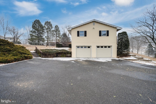 view of property exterior with fence