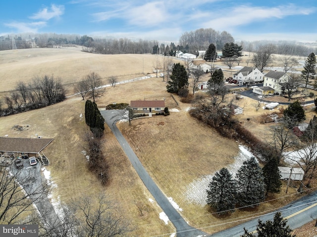 birds eye view of property with a rural view