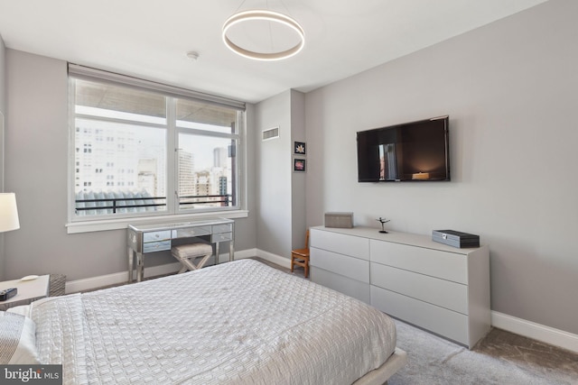 bedroom with visible vents, baseboards, and carpet flooring