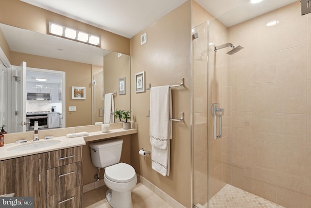 bathroom featuring a shower stall, toilet, and tile patterned floors