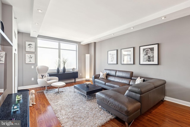 living room featuring recessed lighting, baseboards, and wood finished floors