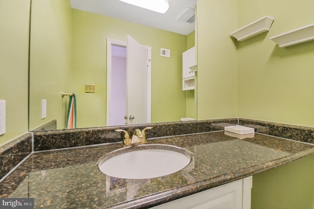 bathroom featuring visible vents and vanity