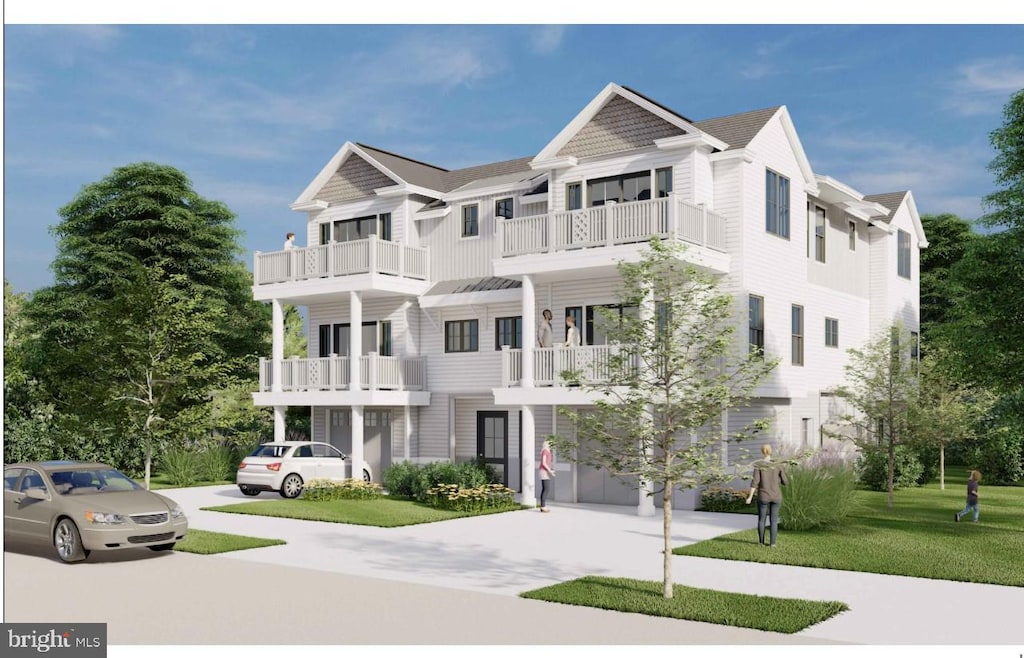 view of front facade with a balcony, an attached garage, a front lawn, and concrete driveway