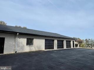 view of side of property featuring a garage