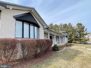 view of home's exterior featuring a lawn