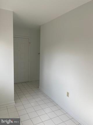 spare room with light tile patterned floors