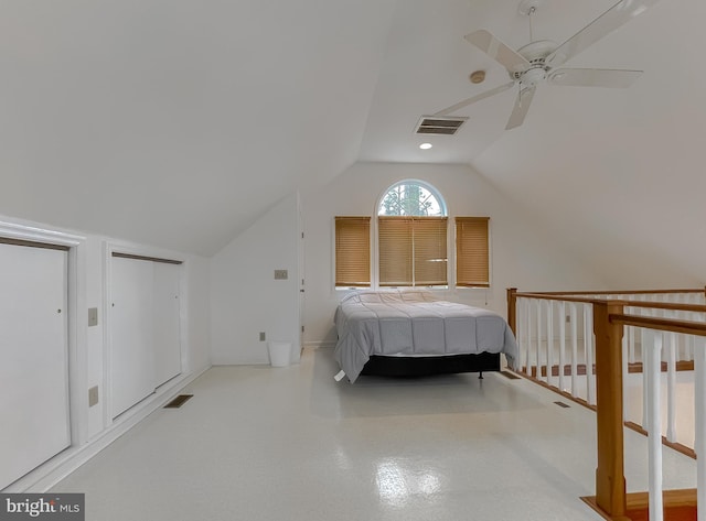 unfurnished bedroom featuring lofted ceiling, baseboards, visible vents, and a ceiling fan