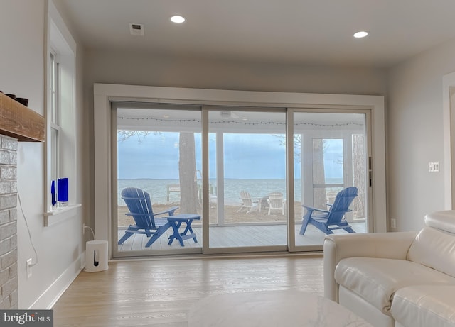 interior space featuring visible vents, wood finished floors, a wealth of natural light, and recessed lighting