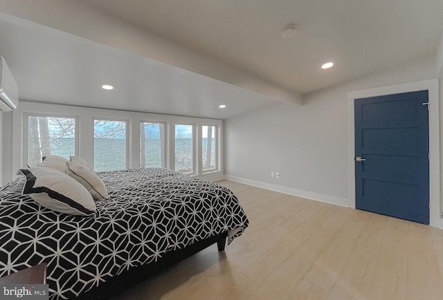 bedroom featuring recessed lighting, beamed ceiling, baseboards, and wood finished floors