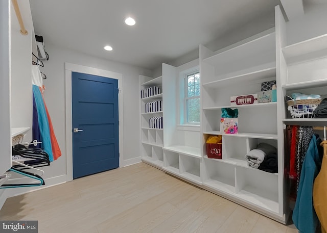 mudroom featuring baseboards, wood finished floors, and recessed lighting