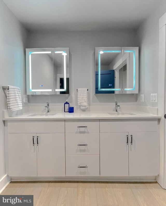 full bath featuring double vanity and a sink