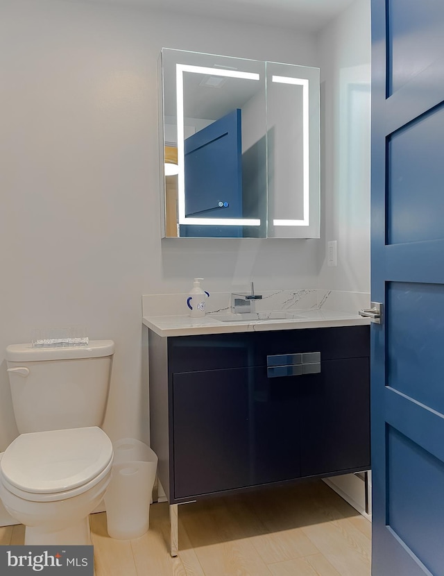 half bath with toilet and vanity