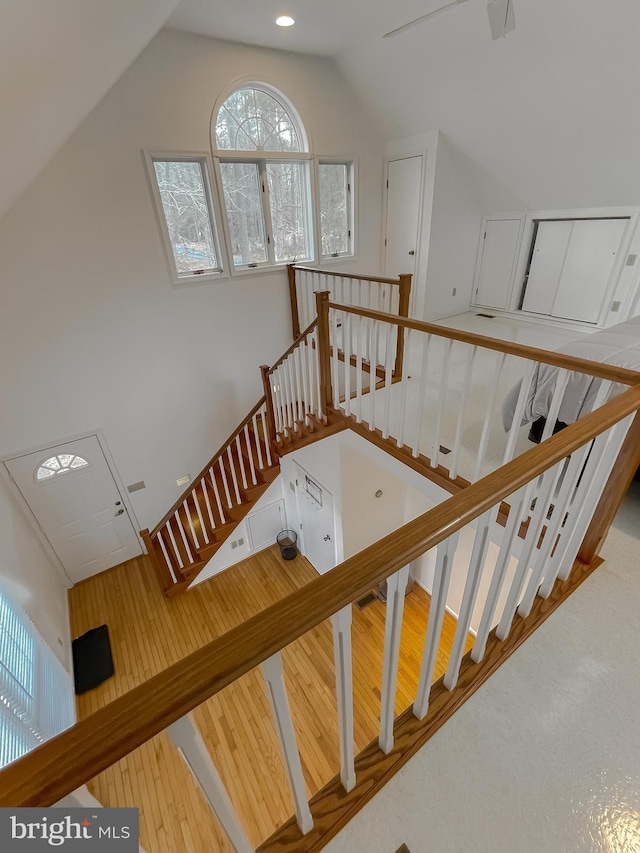 stairway featuring vaulted ceiling