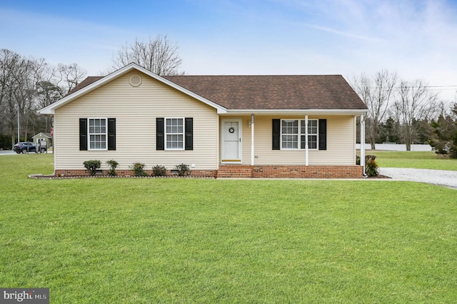 single story home with crawl space, roof with shingles, and a front yard